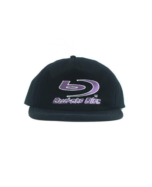 Black flat-brim Snapback cap with a purple and white embroidered Blu-ray Disc logo on the front, set against a plain white background.